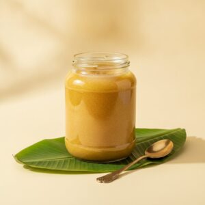 Pure cow ghee 1 litre jar on banana leaf